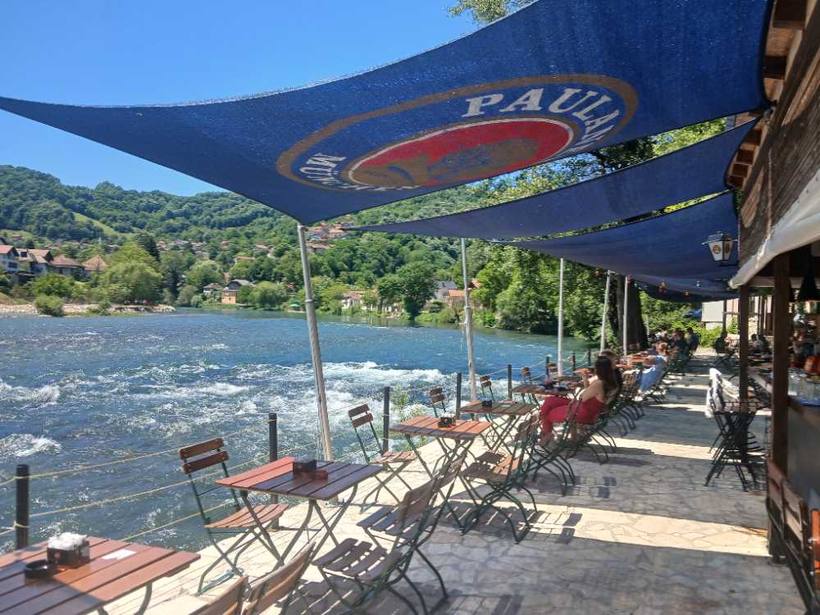 Riverside terrace — Tables right over the water, Banja Luka