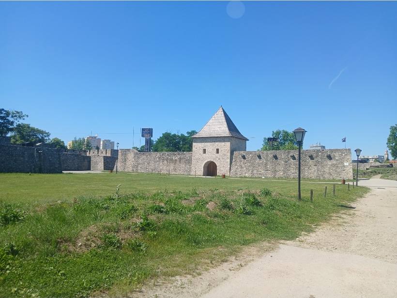 Kastel fortress in Banja Luka seen from outside the west wall, gate tower and rampart above the meadow