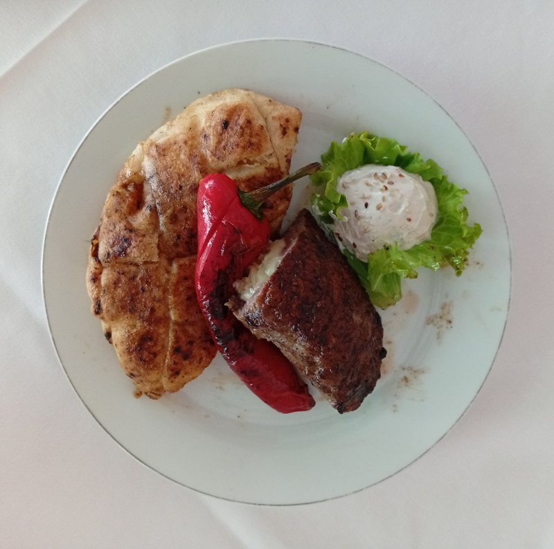 Stuffed pljeskavica — somun, grilled pepper, kajmak